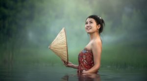 girl in a lake smiling