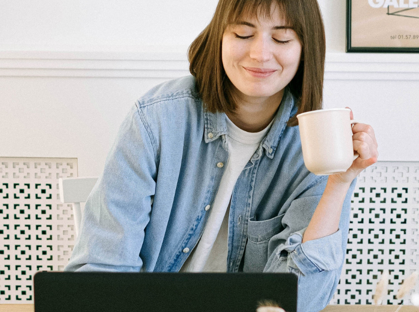 happy girl working and drinking coffee